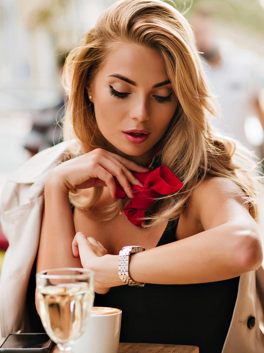 Blond woman waits for her date partner