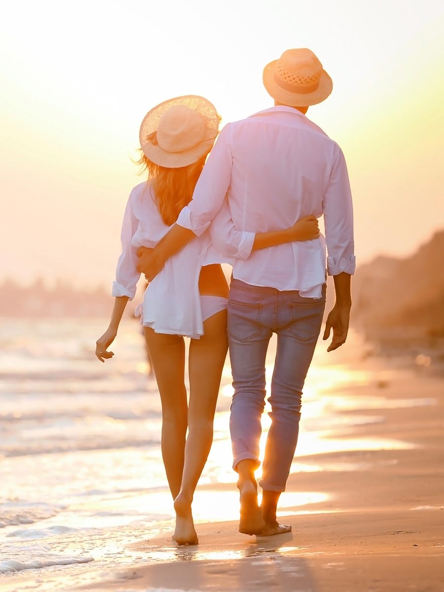 Couple takes a walk on the beach