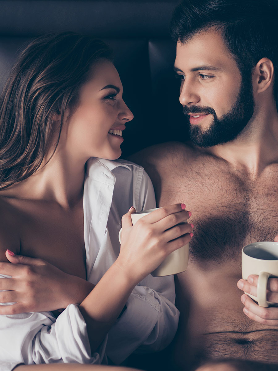 Couple enjoys the morning together in bed
